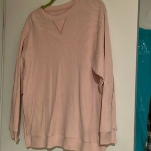 Aerie long sleeve pink waffle top in a light pink color.